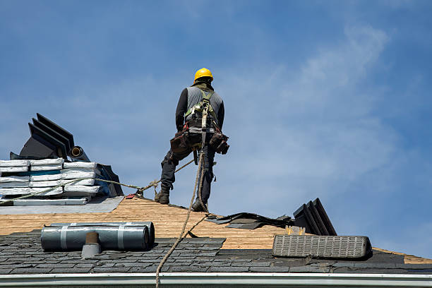 Professional Roofing technician working in East Islip, NY